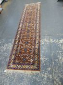 AN ORIENTAL RUNNER OF CAUCASION DESIGN 320 x 80cms.