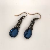A PAIR OF WHITE AND YELLOW METAL EARLY PASTE EARRINGS. THE LARGE BLUE DROPPERS ARTICULATING FROM THE