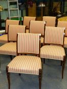 A SET OF EIGHT MAHOGANY SHERATON STYLE SHOW FRAME DINING CHAIRS, THE BACKS WITH OUTWARDLY CURVED TOP