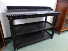 A PAIR OF BESPOKE EBONISED THREE TIER DUMB WAITERS WITH GALLERY BACKS ON TURNED SUPPORTS. 126 x 56 x