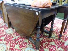 A BESPOKE OAK GATELEG DINING TABLE.