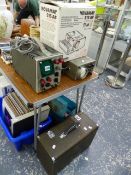 TWO OSCILLOSCOPES, SEWING MACHINE AND A PROJECTOR.