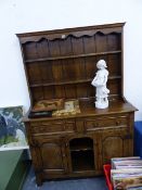 A BESPOKE OAK SMALL DRESSER AND PLATE RACK.