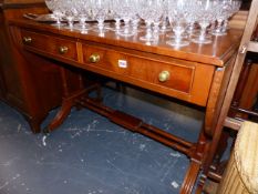 A REGENCY STYLE MAHOGANY SOFA TABLE.