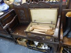 A CARVED OAK HALL SETTLE,