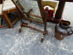 A VICTORIAN MAHOGANY SWING MIRROR AND A STONEWARE JUG.