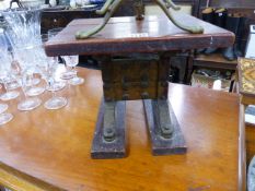 AN UNUSUAL TEAK AND BRASS STOOL.