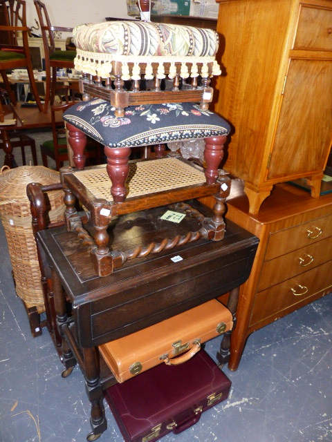 A TEA TROLLEY, THREE STOOLS AND TWO BRIEFCASES.