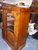 A VICTORIAN WALNUT MUSIC CABINET AND A BERGERE ARMCHAIR.