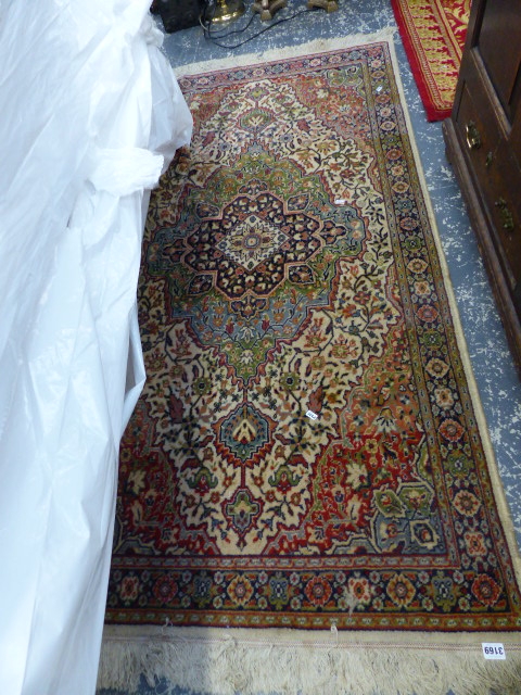 FOUR PERSIAN PATTERN RUGS AND CARPETS.