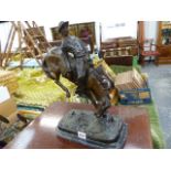 A BRONZE FIGURE COWBOY AND BRONCO.