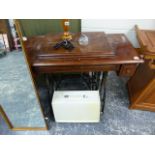 A TREADLE SEWING MACHINE AND ONE OTHER.