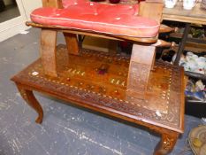AN EASTERN INLAID COFFEE TABLE AND A STOOL.