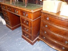 A SMALL WRITING DESK AND A SERPENTINE FRONT CHEST OF DRAWERS.