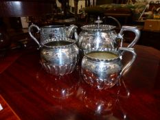 A SILVER PLATED THREE PIECE TEASET AND A FURTHER CREAM JUG