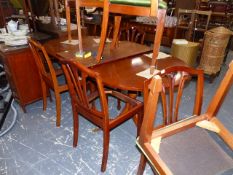 A REPRODUCTION REGENCY STYLE DINING SUITE COMPRISING TABLE, EIGHT CHAIRS, SERPENTINE SIDEBOARD AND