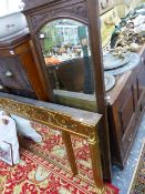 A REGENCY STYLE GILT FRAMED OVERMANTLE MIRROR AND AN OAK FRAMED MIRROR.