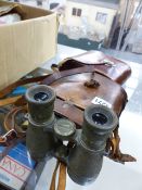 A VINTAGE PAIR OF GERMAN BINOCULARS AND A PAIR OF ZEISS JENOPTEM BINOCULARS.