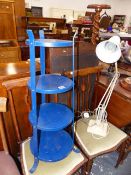 A FOUR TIER POT STAND AND AN ANGLE POISE LAMP.