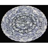 Large Chinese blue and white Yuan Dynasty-style porcelain charger, 23" diameter.