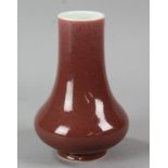 Chinese red glazed vase with Qianlong mark on base, 7" H.