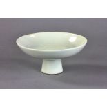 Chinese white glazed pottery bowl, high foot shaped, 7" diameter.