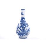 The vase has a pear body rising to the long neck, boldly decorated in various shades of cobalt