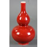 Chinese red glazed double-gourd porcelain vase with Qing Qianlong mark, 9" H.