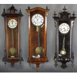 Group of three wall clocks, tallest 31" H. Provenance: Hampton, New Hampshire estate.
