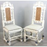 Pair of painted side chairs with ornately carved backs, bird and fruited vine motif, 43 1/2" H x