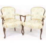 Pair of decorative French-style floral upholstered armchairs, 35" H x 25" W x 21" D.