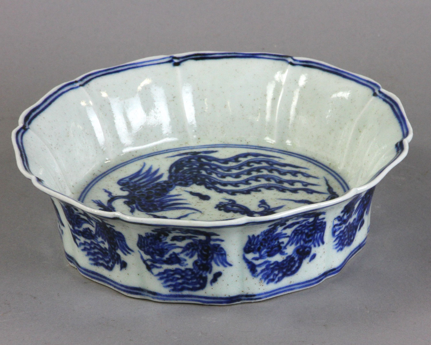 Chinese blue and white dragon bowl having six character marks, 2" H x 7" diameter. Provenance: