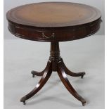 Circa 1940 Regency-style mahogany leather-top drum table, 30"h. x 32" dia.