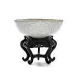 The bowl with a shallow form, standing on a neatly finished foot, the foot rim is fully glazed,