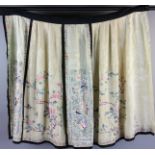 Chinese 19th century white embroidered skirt, 19th century with flower design, 34" H x 62" W.