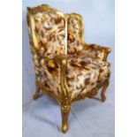 Bergere chair, gold finished frame with fine upholstery, 44" H x 30" W x 29" D.