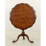 18th century English tilt top table, carved wood, 27" h x 30" diameter.