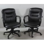 Pair of black faux leather rolling, adjustable office armchairs, 38" H x 26 1/2" W x 24" D.