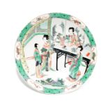 Dish with bold and bright enamels depicting court ladies chatting in the garden, encircled by