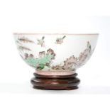 The bowl is well potted with deep rounded sides resting on a short straight foot, brightly