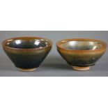 Two Jian-type black glazed porcelain bowls, 5" diameter.