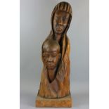 Roger Francois (Haitian, 20th century), carved wood figure depicting mother and child, signed on