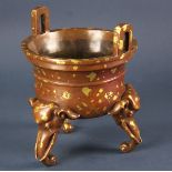 Chinese bronze censer with two elephant ear handles and three carved elephant head shaped legs, with