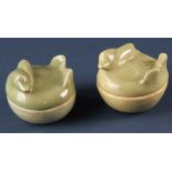 Two Chinese covered celadon boxes, 2 1/2" diameter.