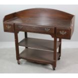 Oak three-drawer desk on casters by Cushman Colonial, General Interiors, Bennington, Vermont, 41"