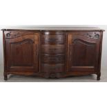 19th century French oak sideboard, floral carving above doors, 42" H x 79" W x 22" D.