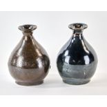 Two 19th century Japanese black-glazed sake bottles, 7" H.