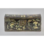 Chinese lacquered dome-top trunk with chinoiserie decoration, 9" H x 20" W x 8" D. Provenance: