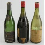 Group of three (empty) bottles, to include: 1955 Puligny-Montrachet; 1934 Domaine de la Romanee-