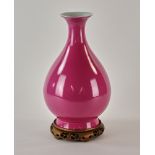 Chinese pink glazed porcelain Yuhuchun vase, 13" H. With wood stand.